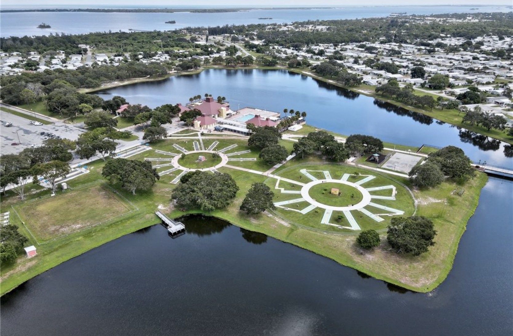 Aerial view of Barefoot Bay’s recreation center, swimming pool and lake